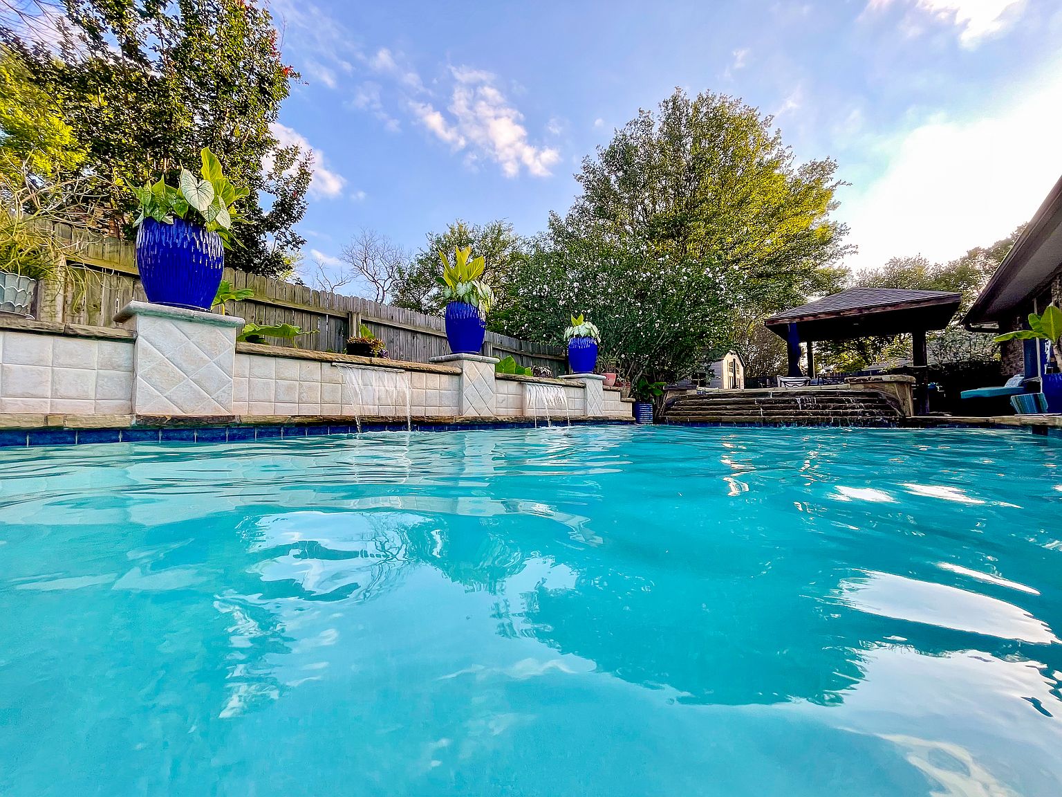 2006 Candle Ct — pool with fountains and stone waterfall